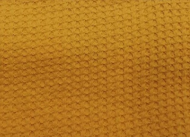 Waffle fabric swatch showing detailed texture and grid pattern.